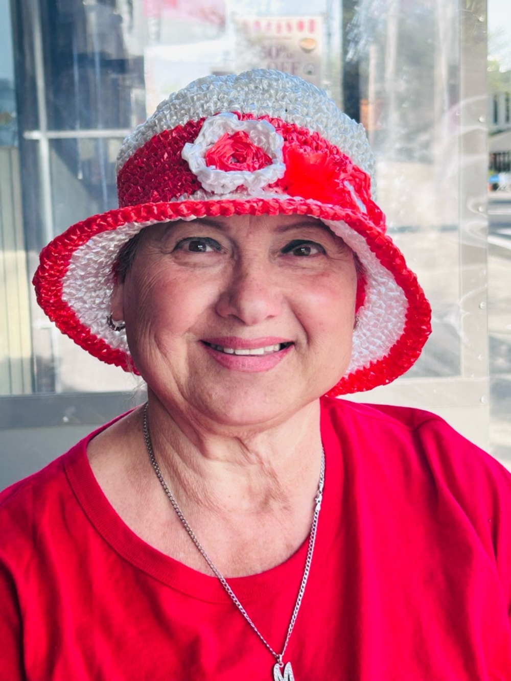 Red and White Crochet Bucket Hat with Floral Accent